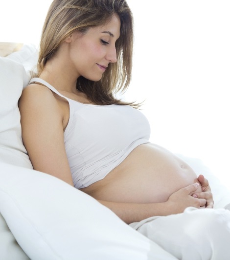 Pregnant woman relaxing at home.
